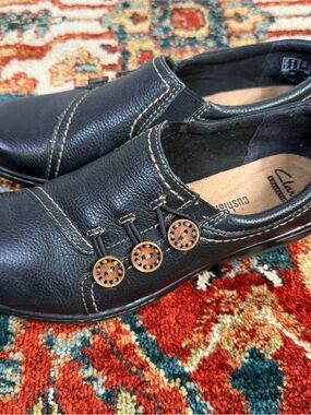 Clarks Black Leather Slip-On Loafers with Copper Button Detail